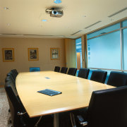 View of the meeting room, long large wooden conference hall, furniture, interior design, office, table, orange