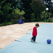 View of automatic pool covers by GB Pool child, fun, grass, green, leisure, outdoor structure, plant, play, public space, recreation, tree, vacation, white, black