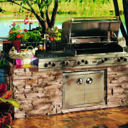 Outdoor barbeque set into stone wall base. - backyard, barbecue, barbecue grill, outdoor grill, black