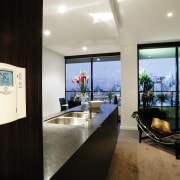 Open plan kitchen and lounge area with climate interior design, real estate, black, gray