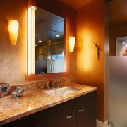 View of bathroom vanity with marble vanity top, bathroom, ceiling, countertop, interior design, lighting, room, brown