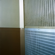 Perforated metal panels on feature wall. - Perforated daylighting, glass, line, mesh, product, wall, window, gray