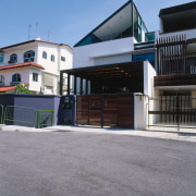 view of this townhouse with a stepped pitched architecture, building, facade, house, luxury vehicle, property, real estate, gray