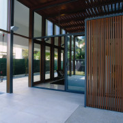 view of the glazed glass doors - view architecture, courtyard, daylighting, estate, facade, house, property, real estate, window, black, teal