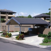 view of the carport and monier concrete tile home, house, outdoor structure, property, real estate, residential area, roof, gray