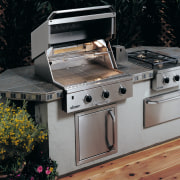 Close up view of a large stainless steel barbecue, barbecue grill, gas stove, home appliance, kitchen appliance, kitchen stove, major appliance, outdoor grill, outdoor grill rack & topper, black, gray