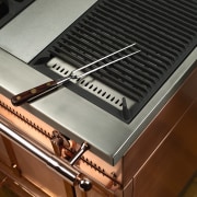 View of the BBQ stove top, copper oven, outdoor grill, brown, black, gray