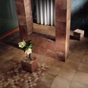 Tiled area with mosaic tile feature and columns. architecture, floor, flooring, hardwood, interior design, lighting, tile, wall, wood, wood flooring, brown, red