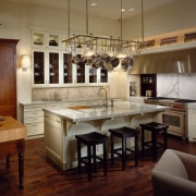 view of this ktchen by de guillo showing cabinetry, ceiling, countertop, cuisine classique, flooring, hardwood, interior design, kitchen, room, wood flooring, brown, red