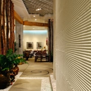 View of a corridor in the mall, concrete architecture, ceiling, floor, flooring, interior design, lobby, real estate, wall, wood, brown, orange