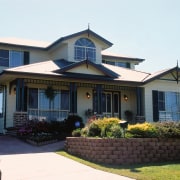 Exterior of two storey house with fibro cladding, cottage, elevation, estate, facade, home, house, mansion, neighbourhood, property, real estate, residential area, roof, siding, window, white, black