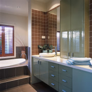 view of the custom bathroom cabinets with a bathroom, bathroom accessory, bathroom cabinet, cabinetry, countertop, flooring, interior design, room, gray