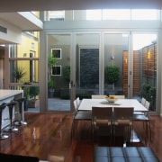 Open plan kitchen and dining area with timber interior design, real estate, window, gray, black