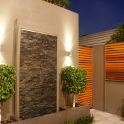 Courtyard area with feature wall, topiary plants, paving architecture, courtyard, estate, facade, home, house, lighting, property, real estate, siding, wall, window, brown, orange