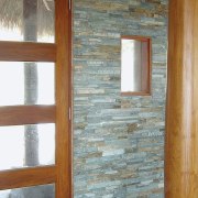 view of the homestone modulised natural stone walling door, floor, hardwood, wall, window, wood, wood stain, gray, brown