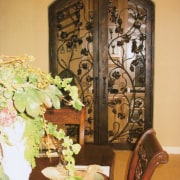 View of a large copper doorway with very dining room, floristry, flower, flower arranging, furniture, interior design, table, brown, orange