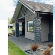 Exterior of home with river stone pillars and cottage, elevation, facade, home, house, property, real estate, siding, window, white, gray