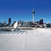 Top area of building showing top of plant atmosphere of earth, building, city, cityscape, daytime, downtown, landmark, line, metropolis, metropolitan area, roof, sky, skyline, skyscraper, urban area, gray, blue