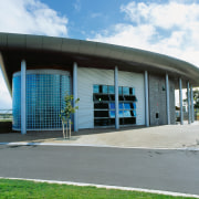 Exterior view of architectural building with blue tinted architecture, building, commercial building, corporate headquarters, facade, structure, gray, white