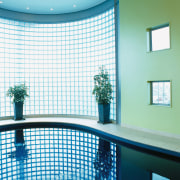 Indoor swimming pool with yellow wall and glass architecture, blue, ceiling, daylighting, daytime, glass, home, interior design, leisure centre, shade, swimming pool, wall, window, window covering, teal, white