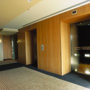 Lobby area with veneered wall panels. - Lobby ceiling, door, floor, flooring, hardwood, interior design, laminate flooring, property, real estate, room, wall, wood, wood flooring, brown