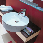 View of a ciecular with basin with chrome bathroom, bathroom cabinet, bathroom sink, ceramic, plumbing fixture, product, product design, sink, tap, red