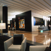 View of hotel lobby with dark and light ceiling, interior design, living room, lobby, black, gray