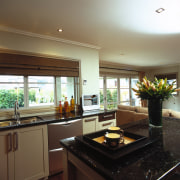 view of the kitchen area and portable  ceiling, countertop, interior design, kitchen, property, real estate, room, window, brown, black