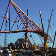 A view of the large building when it bridge, cable stayed bridge, cantilever bridge, construction, construction equipment, crane, extradosed bridge, fixed link, girder bridge, sky, skyway, structure, transporter bridge, truss bridge, blue