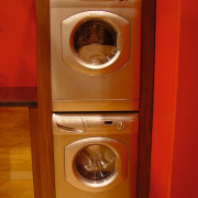 View of a silver clothes dryer in a clothes dryer, home appliance, kitchen appliance, laundry, major appliance, washing machine, red, brown