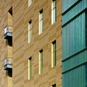 A close up view of the brick walls, apartment, architecture, brickwork, building, commercial building, daylighting, daytime, facade, house, line, siding, structure, symmetry, wall, window, wood, teal