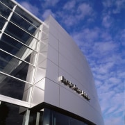 view of the alluminium cladding and high glazed architecture, building, commercial building, condominium, corporate headquarters, daylighting, daytime, facade, headquarters, reflection, sky, skyscraper, structure, blue