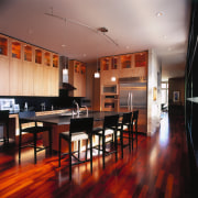 A view of a kitchen and dinig area, ceiling, dining room, floor, flooring, furniture, hardwood, interior design, laminate flooring, restaurant, room, table, wood, wood flooring, red