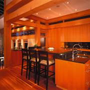 view of the kitchen are featuring timber flooring, ceiling, countertop, flooring, interior design, kitchen, restaurant, table, wood, red