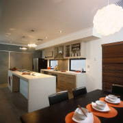 A view of a kitche and dining areas, architecture, ceiling, countertop, interior design, kitchen, gray, black