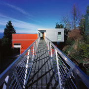 view of this steel bridge that spans a architecture, bridge, facade, fixed link, guard rail, line, plant, road, sky, skyway, structure, tree, blue, black