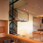 view of the kitchen area and the two architecture, ceiling, countertop, daylighting, home, interior design, kitchen, real estate, stairs, wood, brown