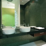 view of the bathroom showing cantilevered vanity, cicrcular architecture, bathroom, floor, interior design, plumbing fixture, room, green, gray