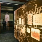 graohic panelling greets visitors at the building entrance exhibition, brown