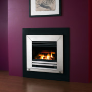 A view of an inbuilt fireplace with black fireplace, hearth, heat, home appliance, wood burning stove, red