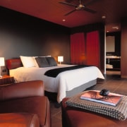 view of the guest bedrooms  that are bed frame, bedroom, ceiling, interior design, lighting, room, suite, wall, black, red