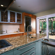 view of the clean designed kitchen featuring stainless cabinetry, countertop, cuisine classique, interior design, kitchen, real estate, window, gray, black