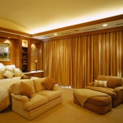 A view of a bedroom, large gold curtains, ceiling, interior design, living room, real estate, room, suite, wall, brown