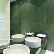 A view of a bathroom, green tiled walls, architecture, bathroom, bidet, ceramic, floor, interior design, plumbing fixture, product design, public toilet, room, sink, tap, tile, toilet, toilet seat, wall, green