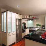 A view of a kitchen area, wooden flooring, cabinetry, ceiling, countertop, home appliance, interior design, kitchen, room, brown, gray