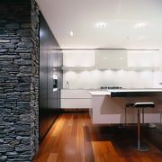 A view of a kitchen area, wooden flooring, architecture, ceiling, countertop, daylighting, floor, flooring, hardwood, house, interior design, kitchen, laminate flooring, loft, room, tile, wall, wood, wood flooring, white, black