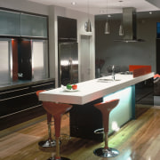 A view of a kitchen, wooden flooring, bar cabinetry, countertop, interior design, kitchen, room, black, gray