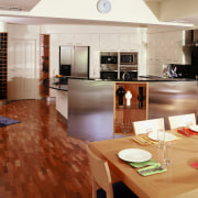View of kitchen and dining area featuring parquetry countertop, floor, flooring, hardwood, interior design, kitchen, laminate flooring, room, wood, wood flooring