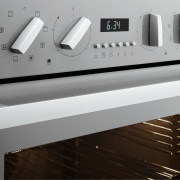 A close up view of a steel oven. furniture, home appliance, kitchen appliance, product design, gray