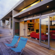 view of the outdoor deck area with good architecture, house, interior design, real estate, window, gray